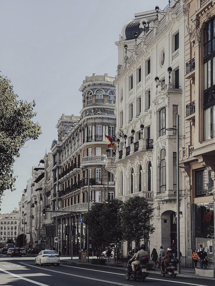 Beautiful city street featuring historic European architecture and bustling urban life.