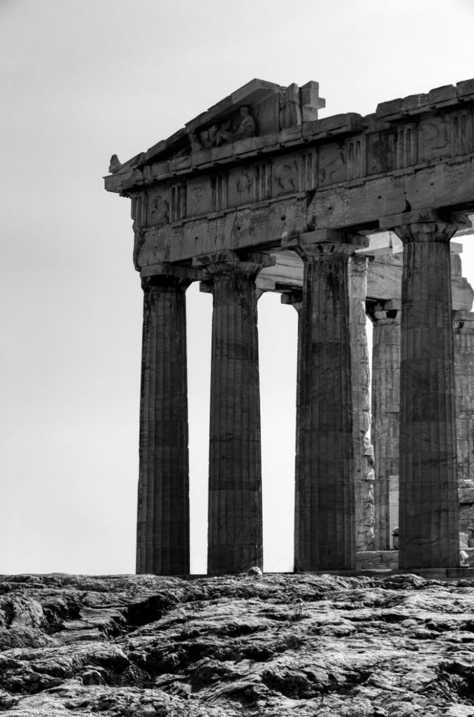 Black and white photograph of the ancient Parthenon ruins in Athens, Greece.