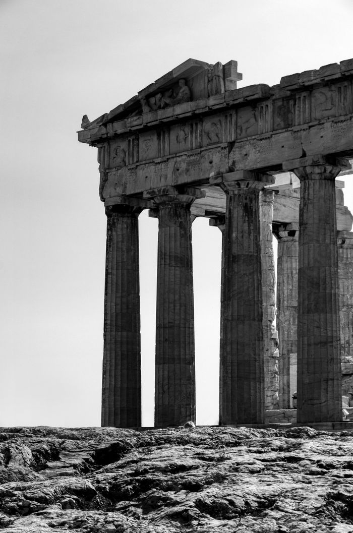 Black and white photograph of the ancient Parthenon ruins in Athens, Greece.